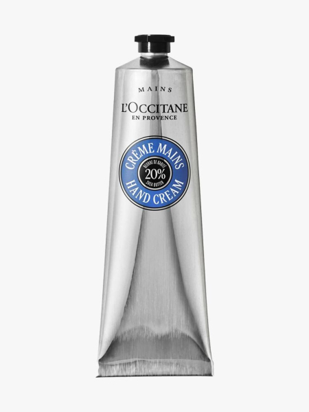 L’Occitane Shea Butter Hand Cream silver tube on light gray background
